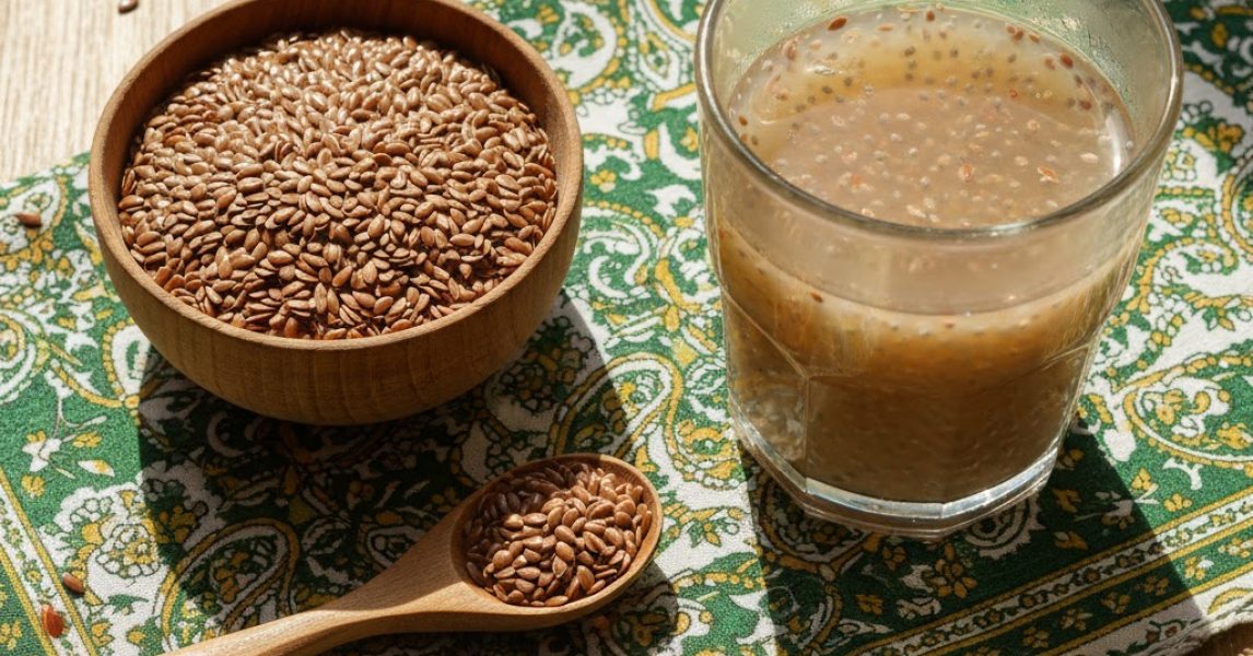 Flax Seeds in Pakistan — organic flax seeds in bowl and spoon with flaxseed drink