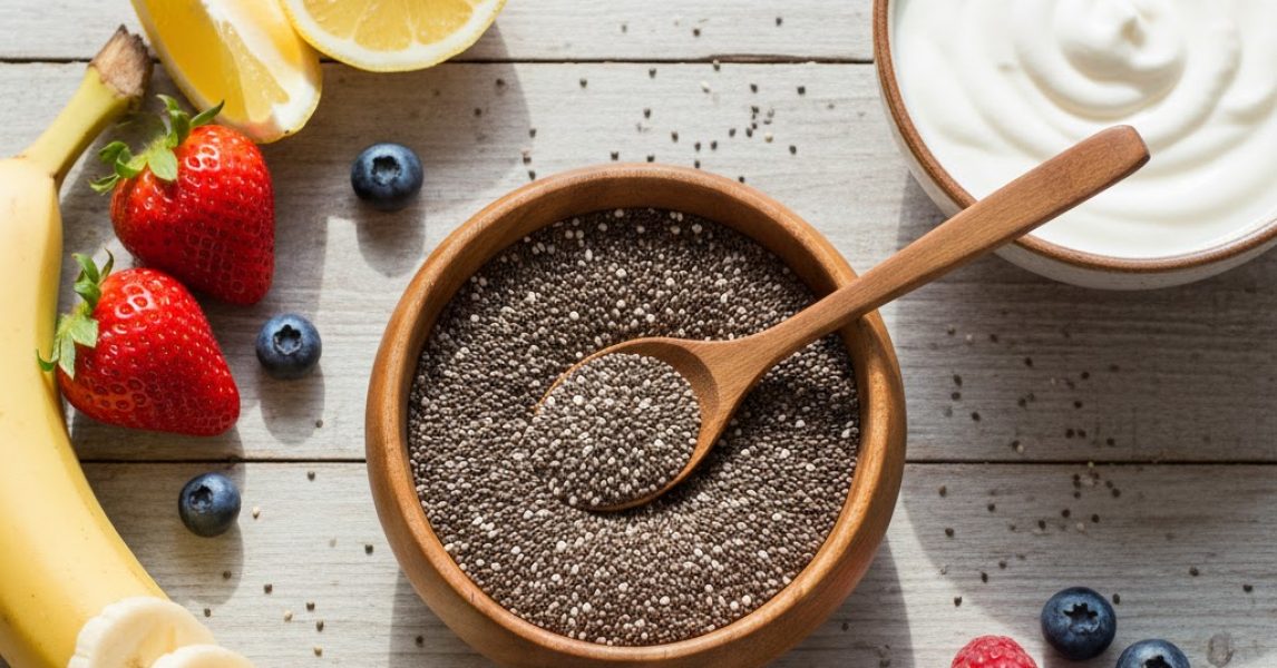 Chia seeds in Pakistan with yogurt and fruits on a wooden kitchen table